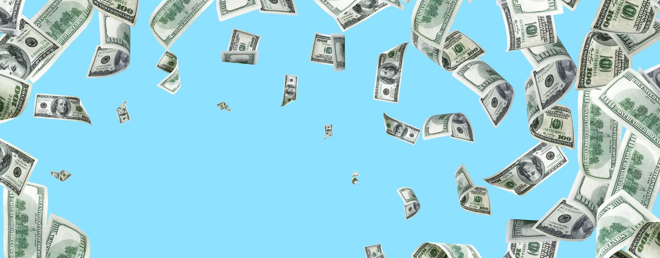 Bunches of one hundred dollar bills falling from the sky.